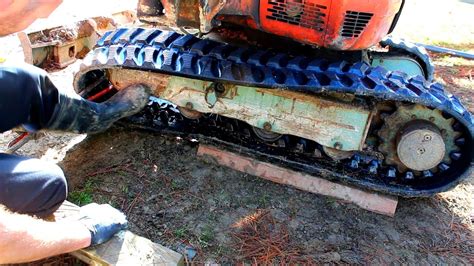 how to change tracks on a mini excavator|tracks for mini excavator maintenance.